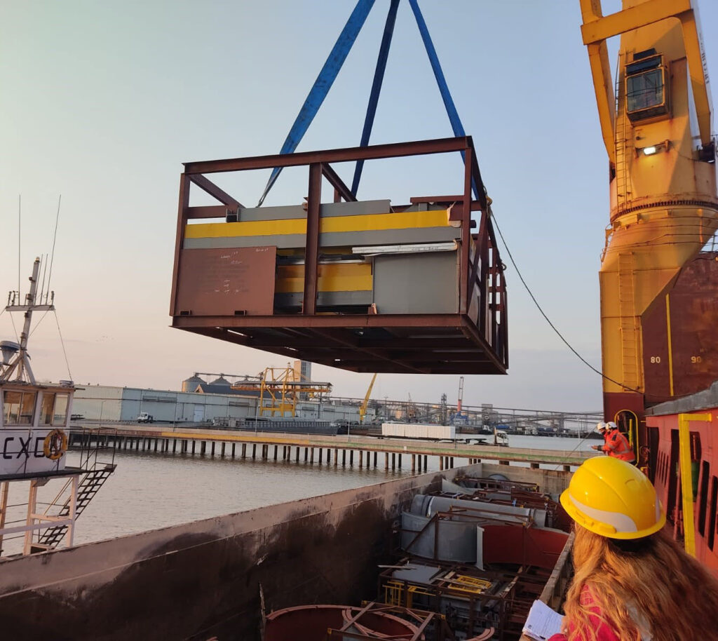 Featured image showing a crain lifiting cargo onto an ocean liner transport ship