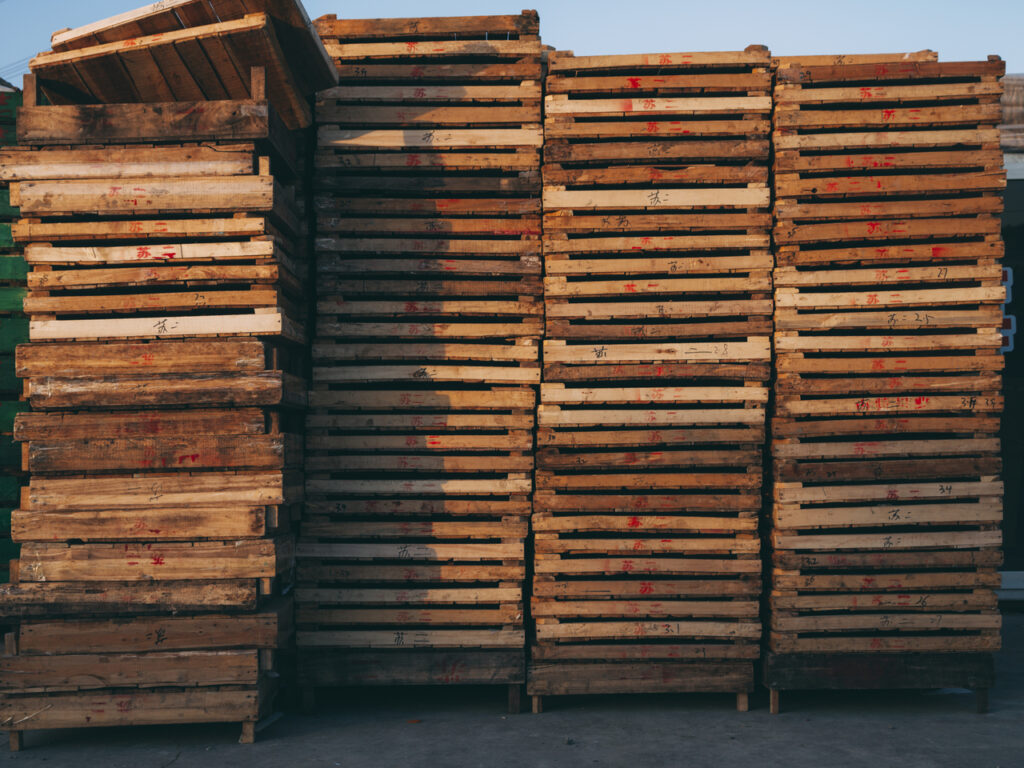 featured image showing stacked wooden pallets