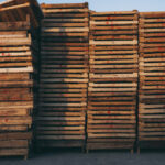 featured image showing stacked wooden pallets