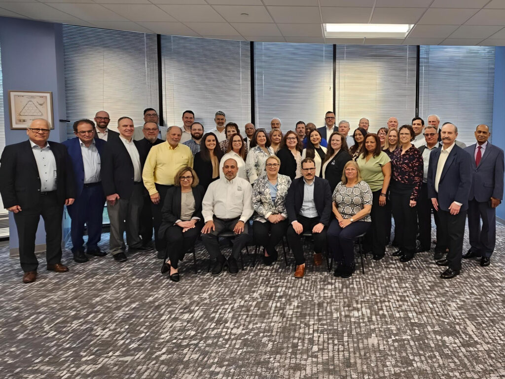 FEatured image showing the UTC Overseas Team at a Leadership Meeting.