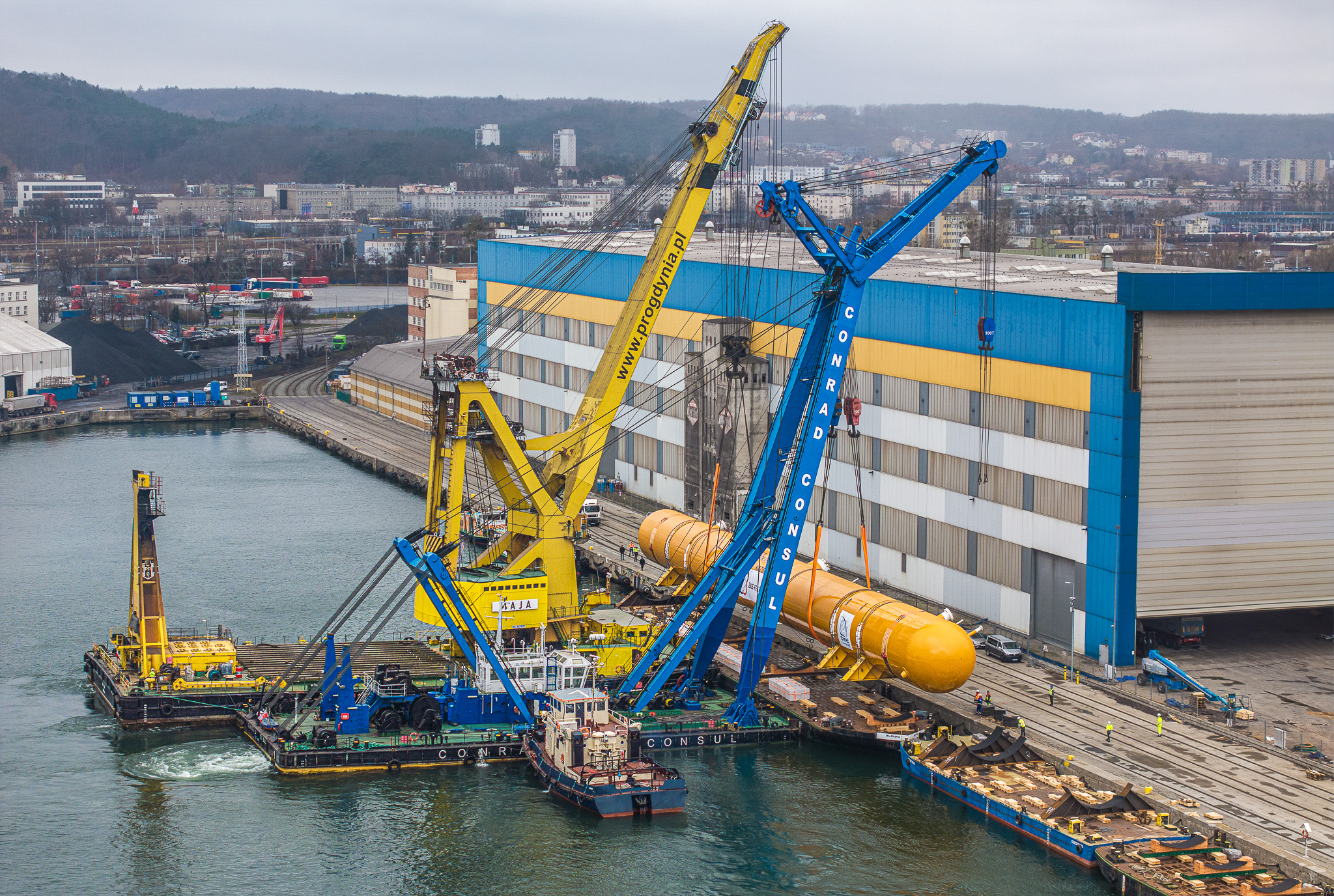 Aerial view of oversized LPG tank loading operation at ZKS Ferrum facility in Gdynia, Poland