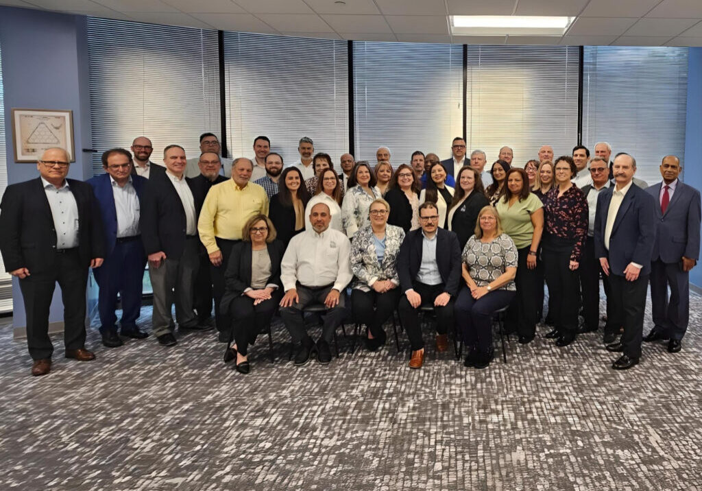 FEatured image showing the UTC Overseas Team at a Leadership Meeting.