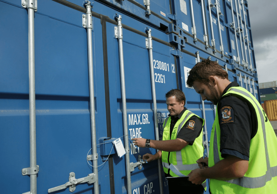 Featured image showing two customs inspectors verifying imports.